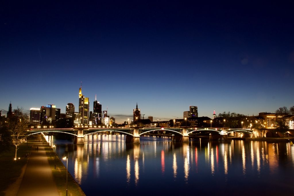 Frankfurt skyline at twilight reflected in the river Main
